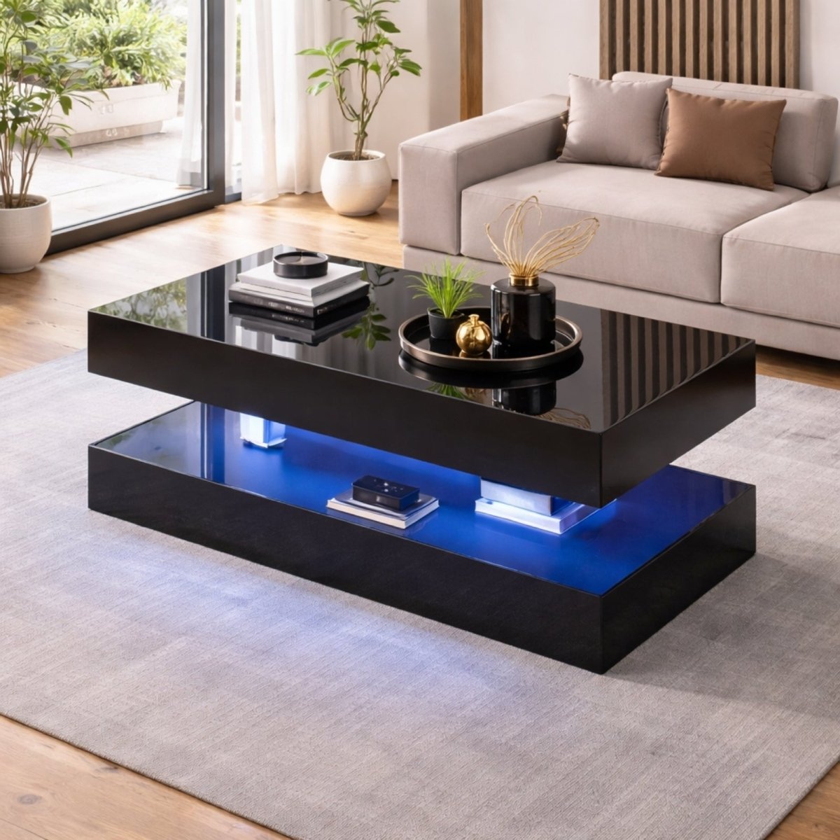 A close-up of the Kouvr Lumina coffee table's integrated LED system, showcasing the purple ambient glow on the lower storage shelf with books.