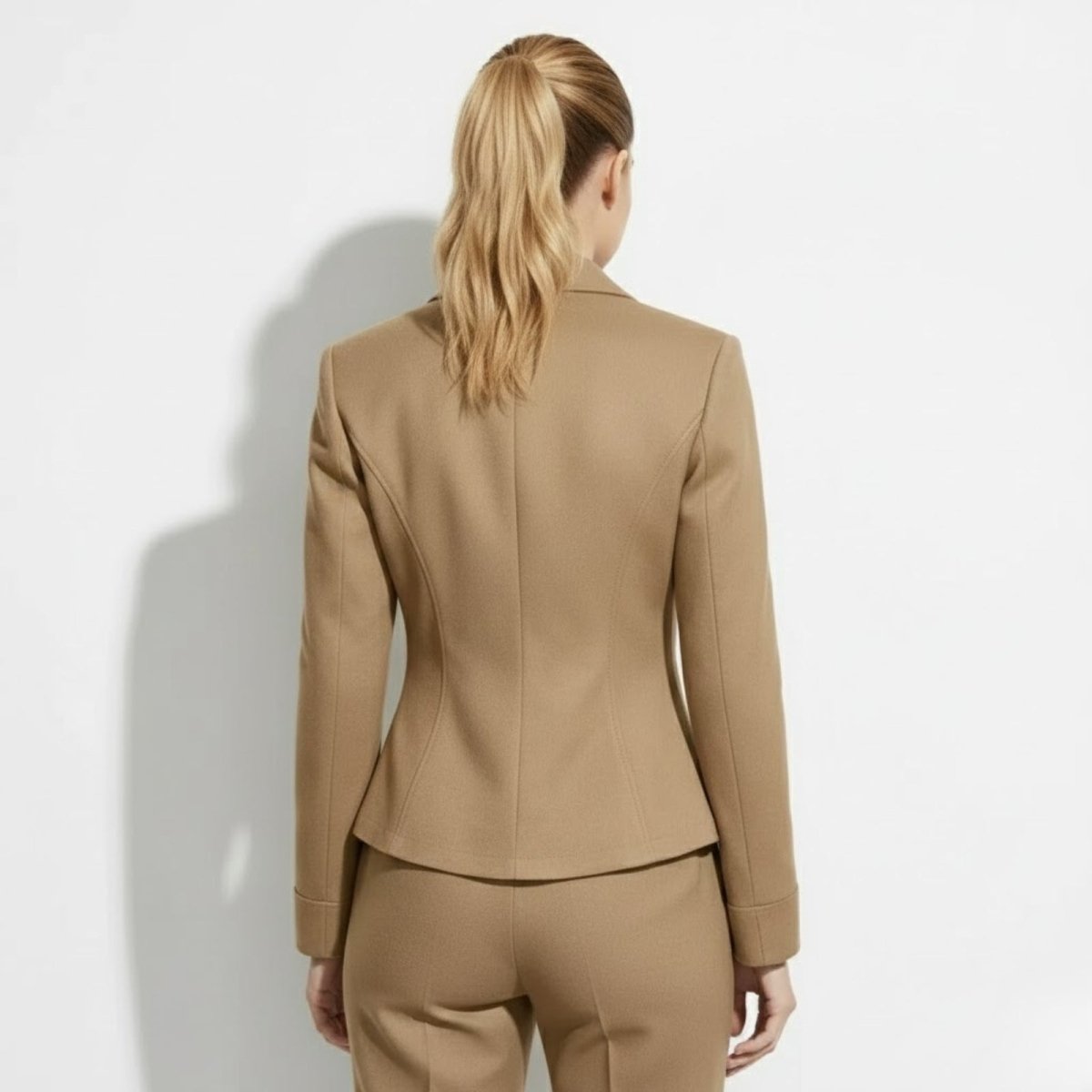 Back view of the Kouvr Maddie khaki blazer showing the figure-flattering princess seams and tailored construction.