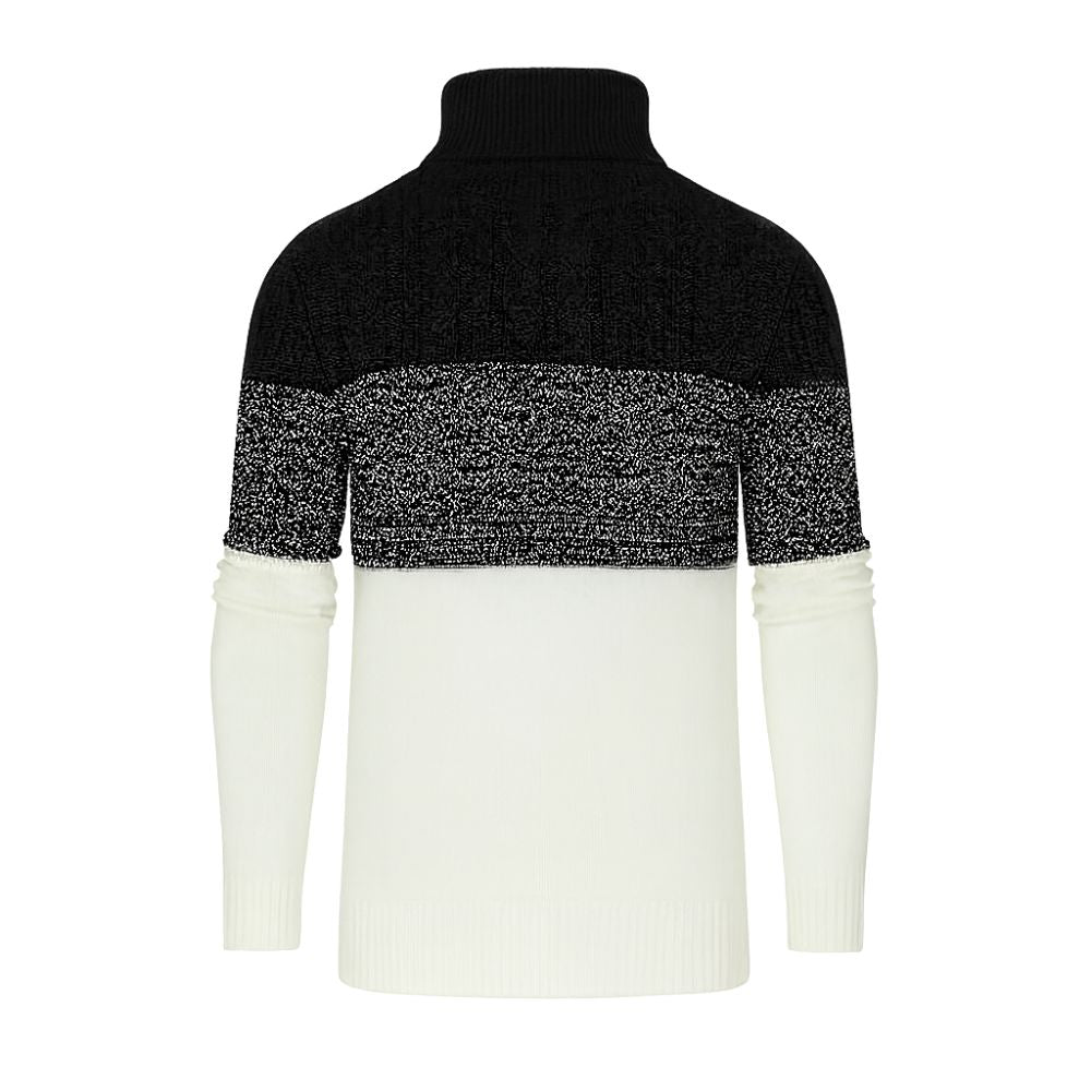 Black and white kouvr sweater with a color-blocked design on a white background