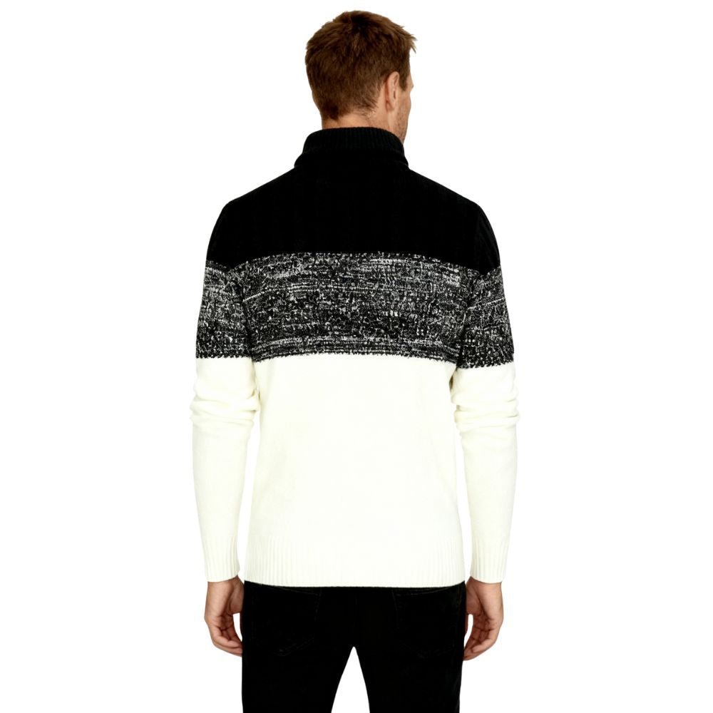 Man wearing a black and white kouvr sweater with a patterned design on a white background