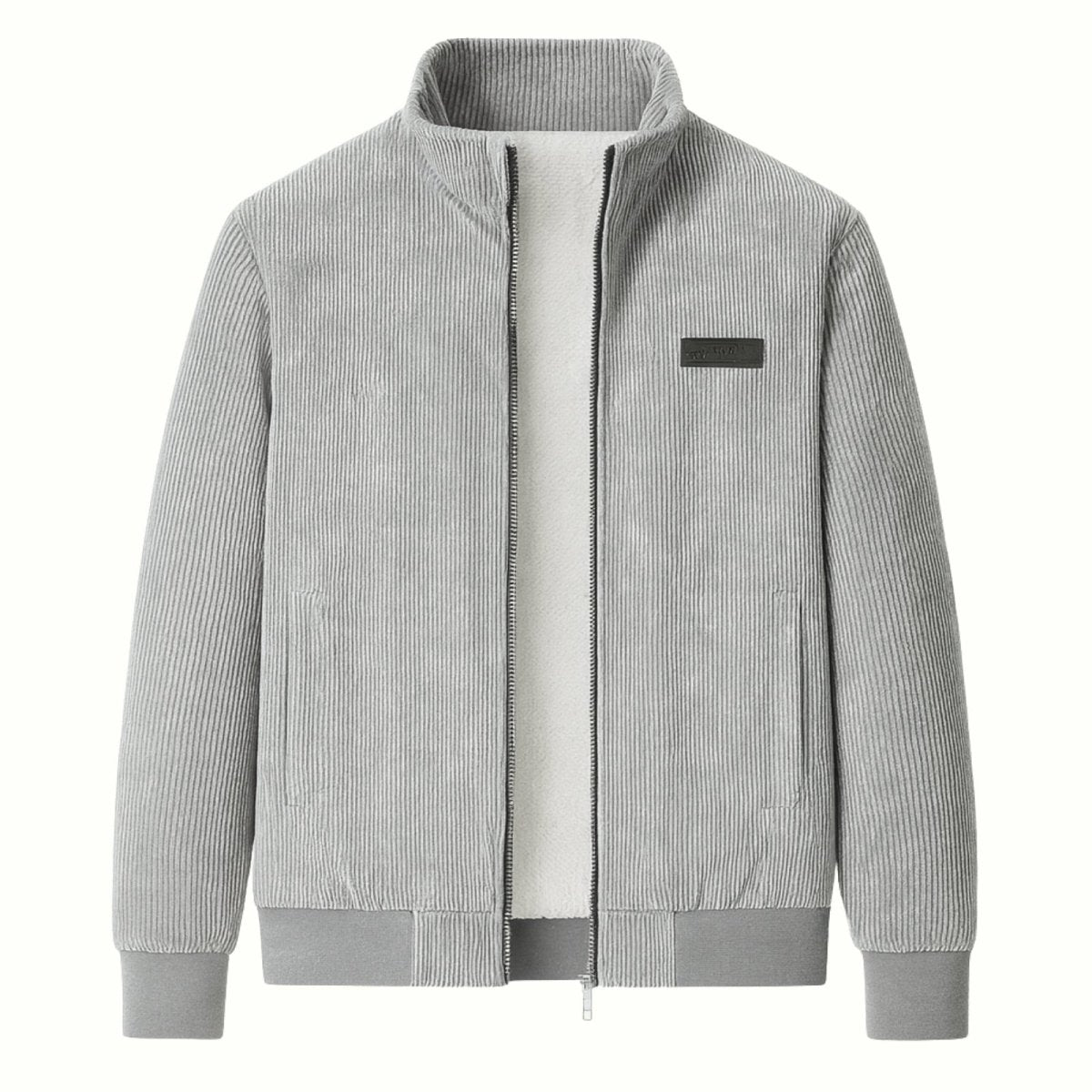 Flat lay photo of an open grey corduroy zip jacket, revealing the full white soft shearling interior and black logo patch.