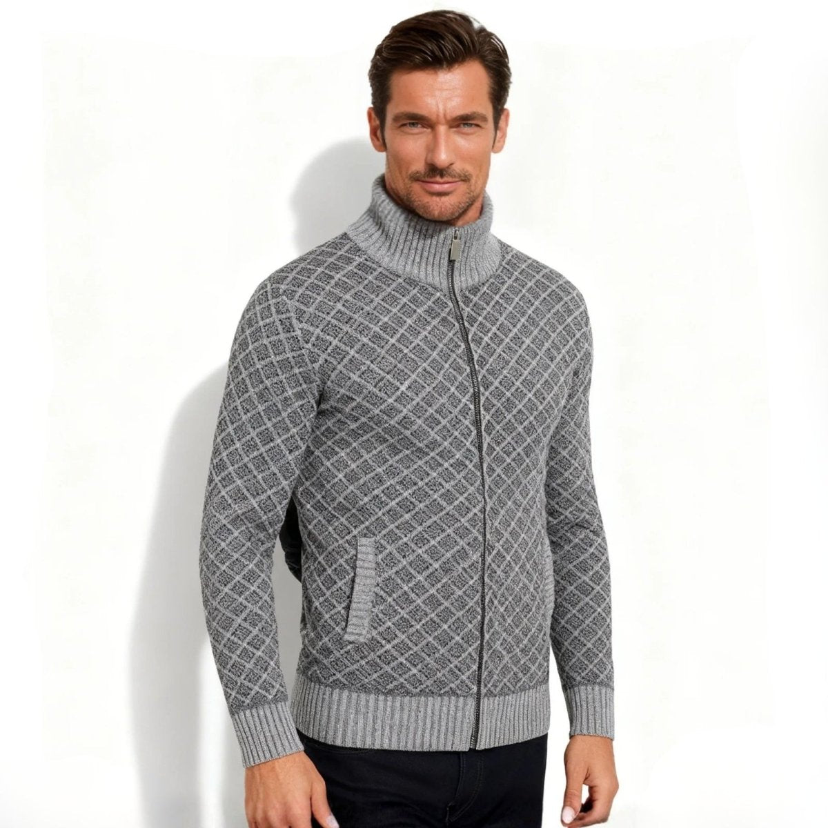 Angled front view of a man in a Kouvr grey merino wool blend sweater jacket with a stand-up collar. 