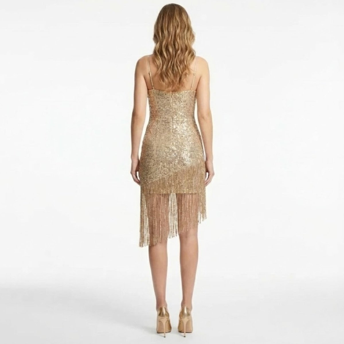 Back view of the Kouvr Phaedra bodycon sequin party dress showing the fit and fringe hem.