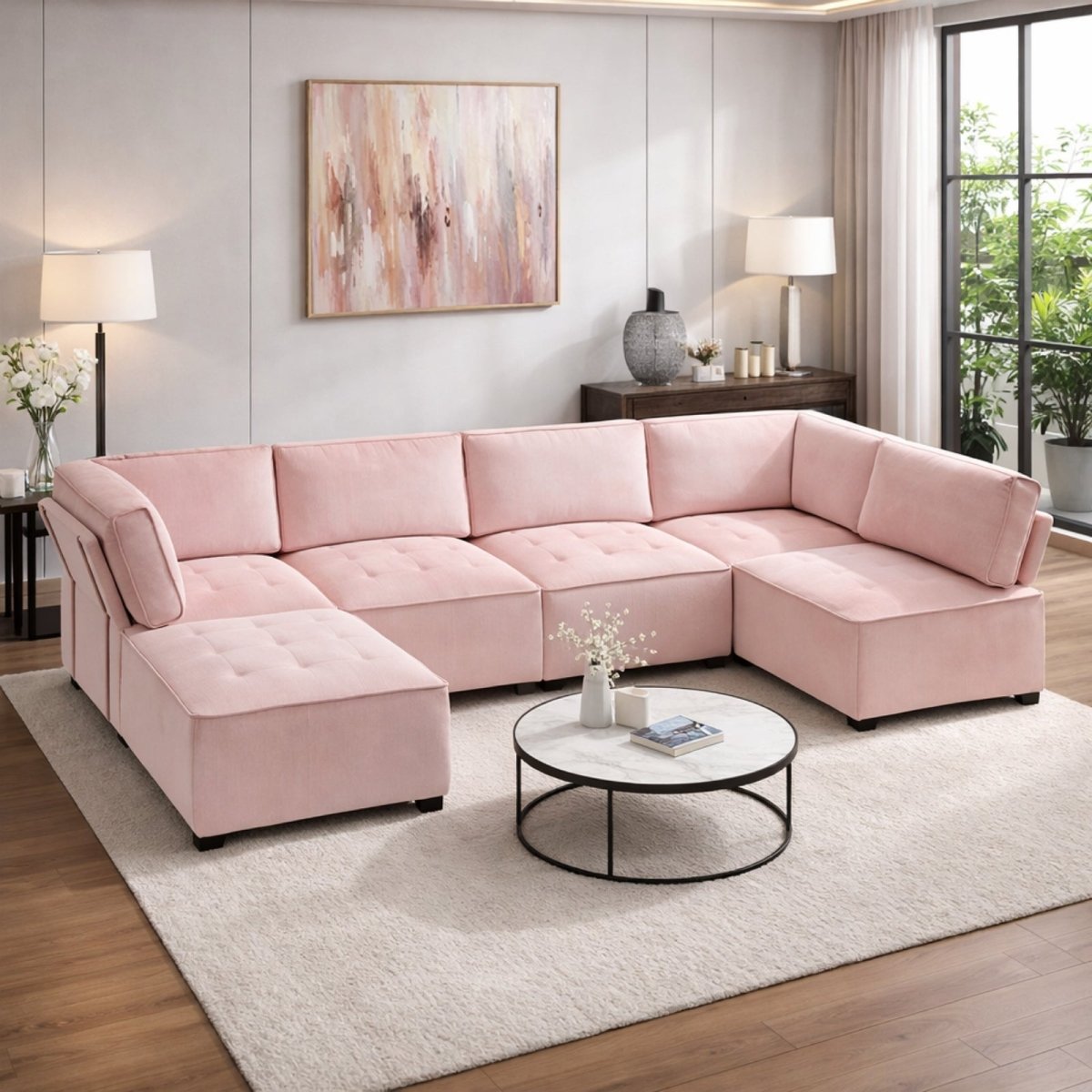 Soft pink blush modular sectional sofa in a bright living space, featuring reversible ottoman and textured corduroy upholstery.
 