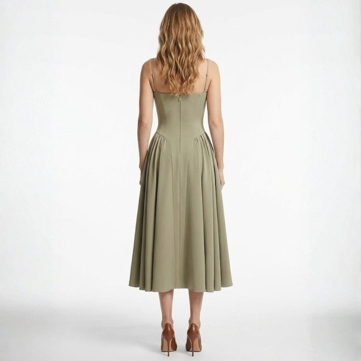 Back view of the Kouvr taupe A-line midi dress showing the spaghetti straps and concealed zipper closure.
