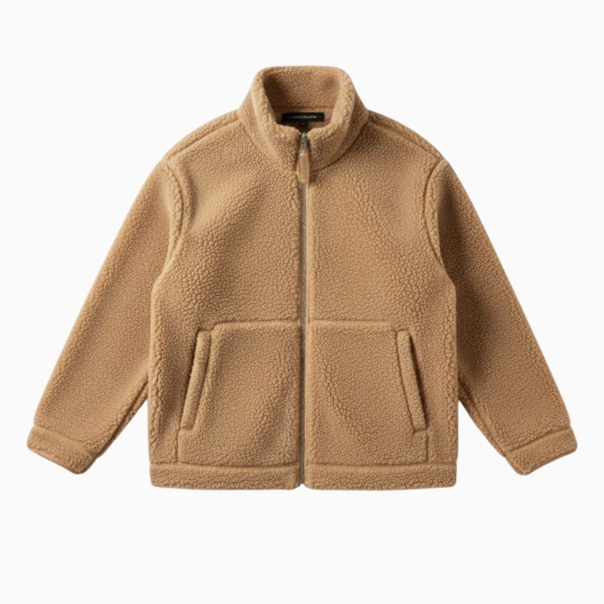 Flat lay studio shot of the front of the Kouvr Julie sherpa fleece jacket, showing the full zip, stand collar, and front patch pockets. 