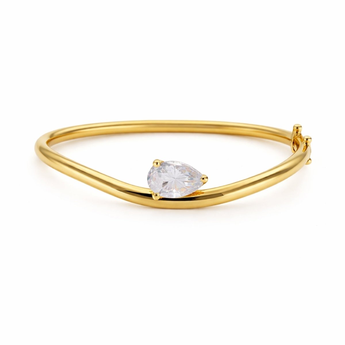 The Kouvr Yelena wave bangle in 18k gold vermeil featuring a large pear-cut crystal on a white studio background.
