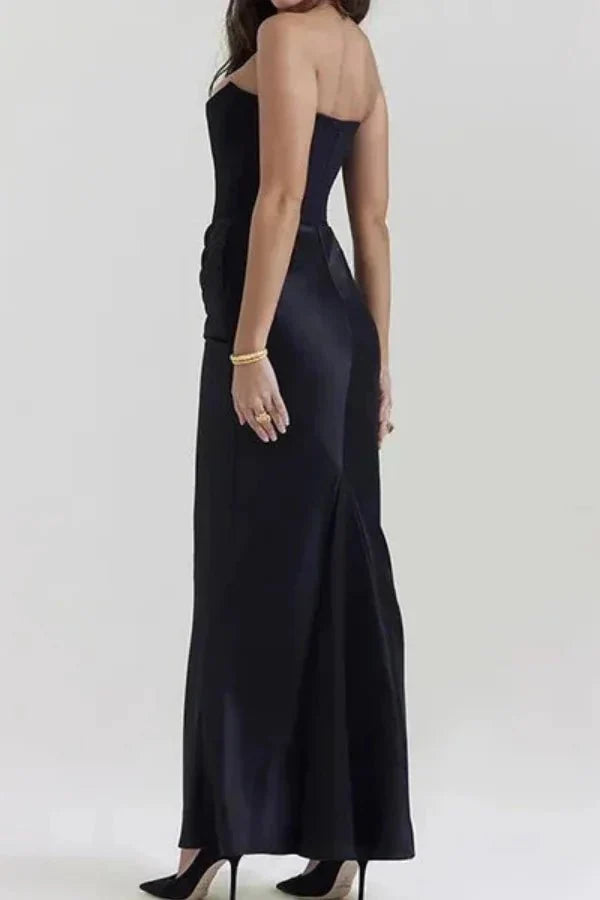 Back view of a model wearing the Kouvr Zanayah black formal evening gown, showing the silhouette and fit.