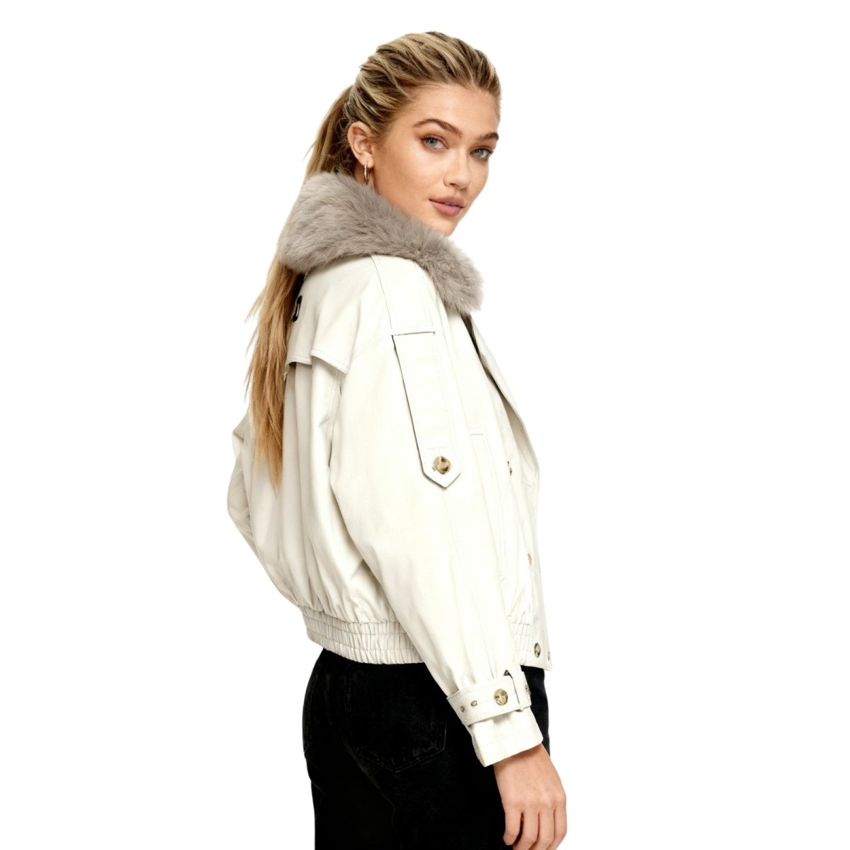 A woman styling the oversized Kouvr Avenly Cropped Trench Jacket in a fitting room.